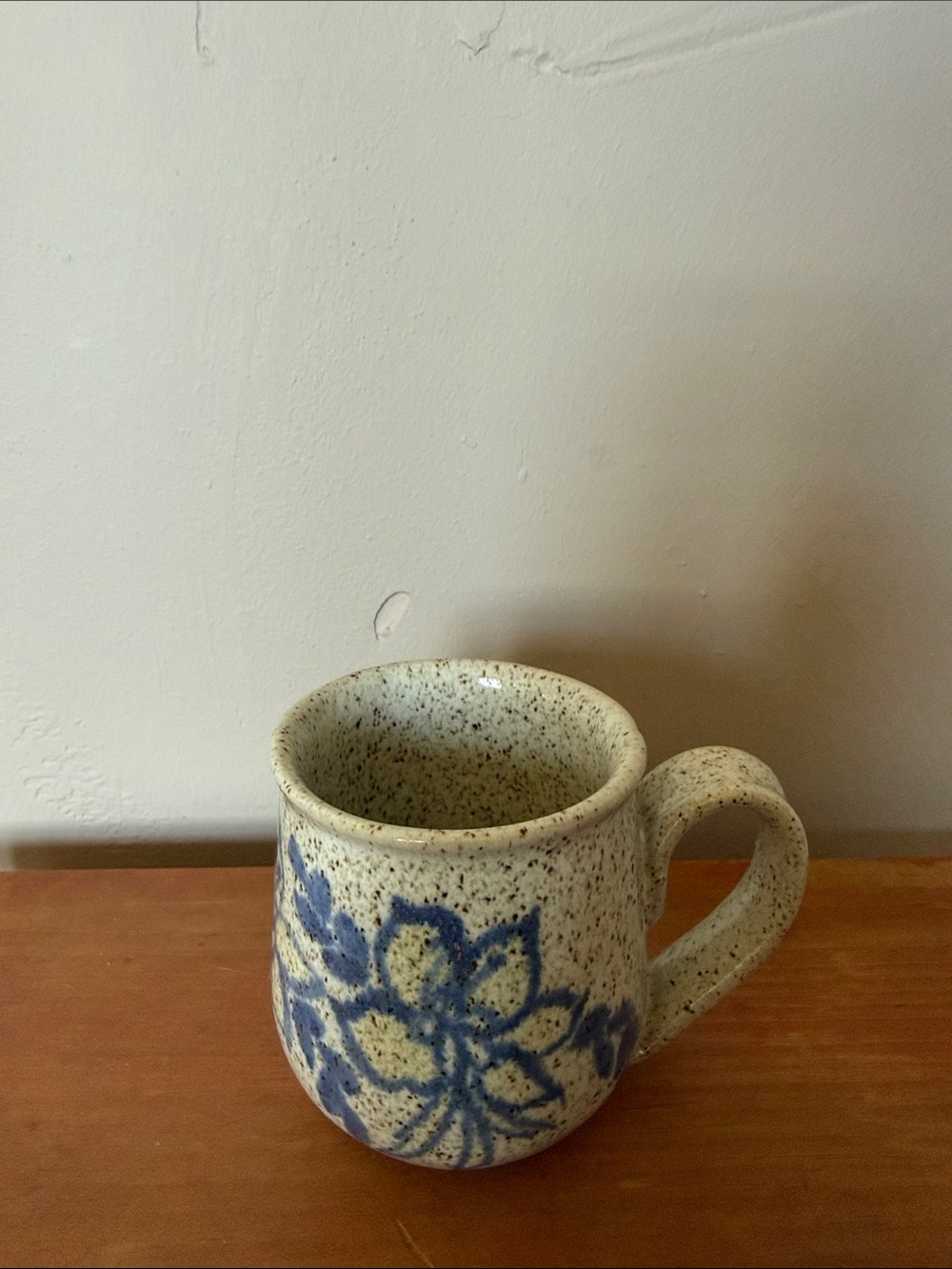 Handcrafted Speckled Ceramic Mug with Blue Floral Design